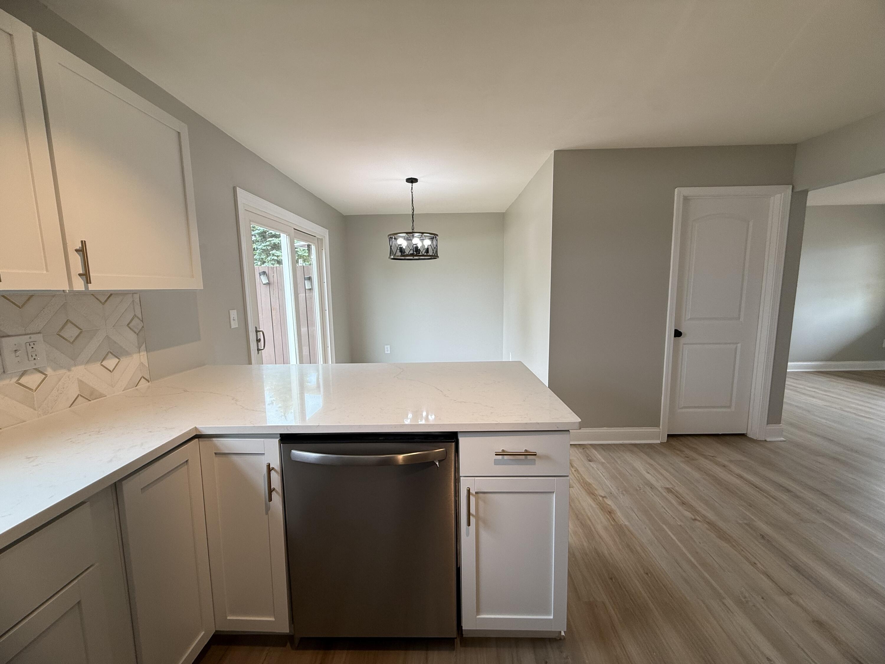 15895 Sherman Street Lowell, IN 46356 - Photo 16 of 36 an empty room with wooden floor
