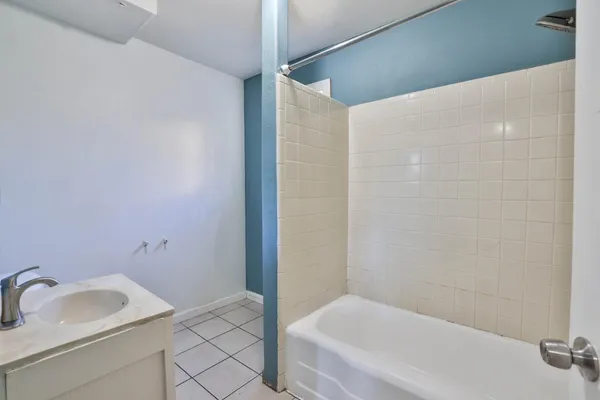 a bathroom with a sink and a bathtub