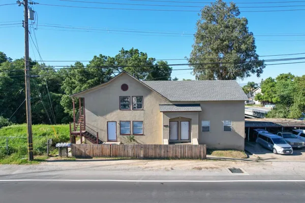 a view of a house with a street
