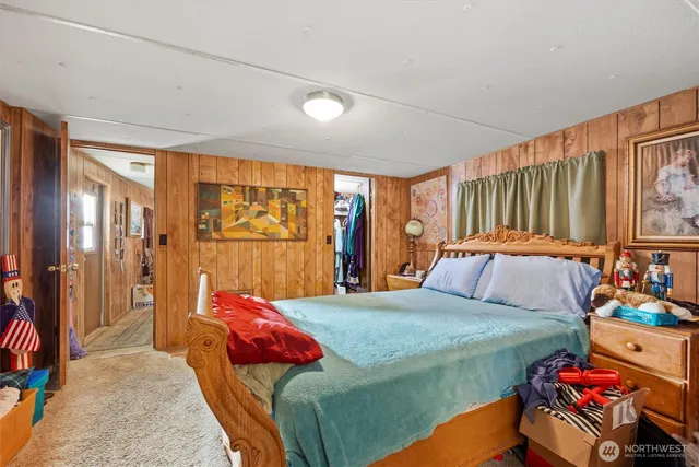 a bedroom with a bed and a couch