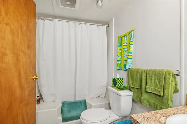 a bathroom with a toilet and a sink