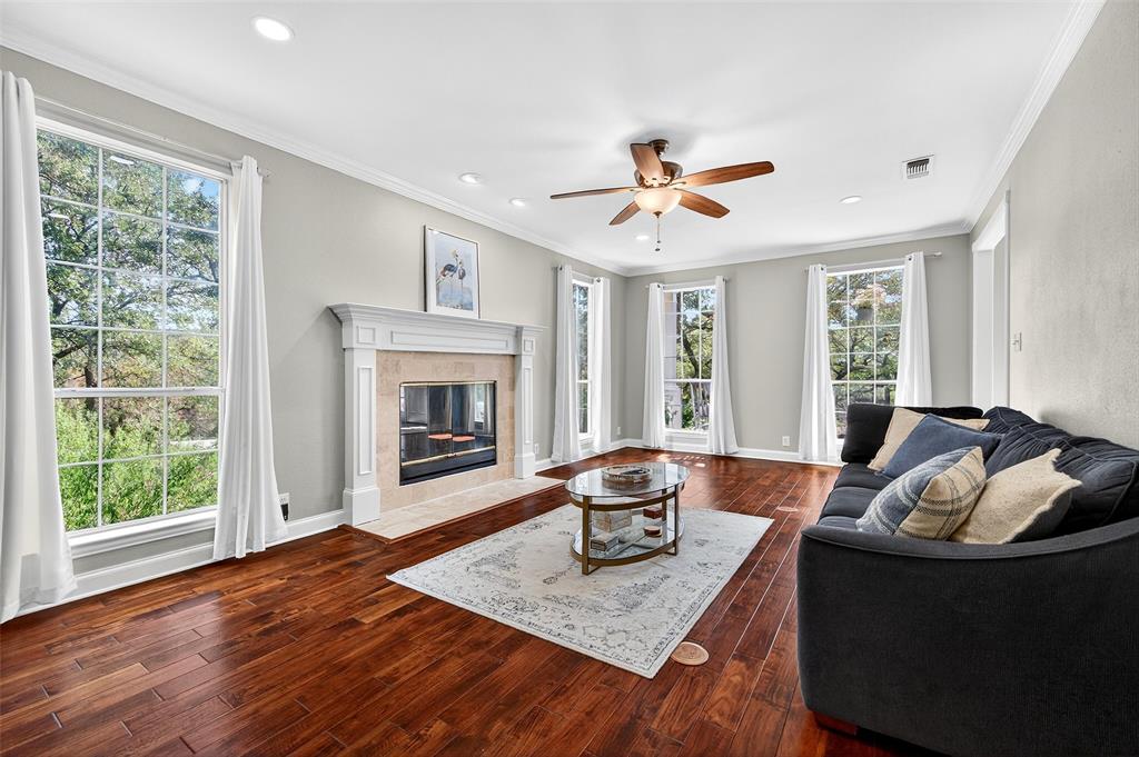 10312 Arvin Hill Road Aubrey, TX 76227 - Photo 12 of 40 a living room with furniture and a fireplace