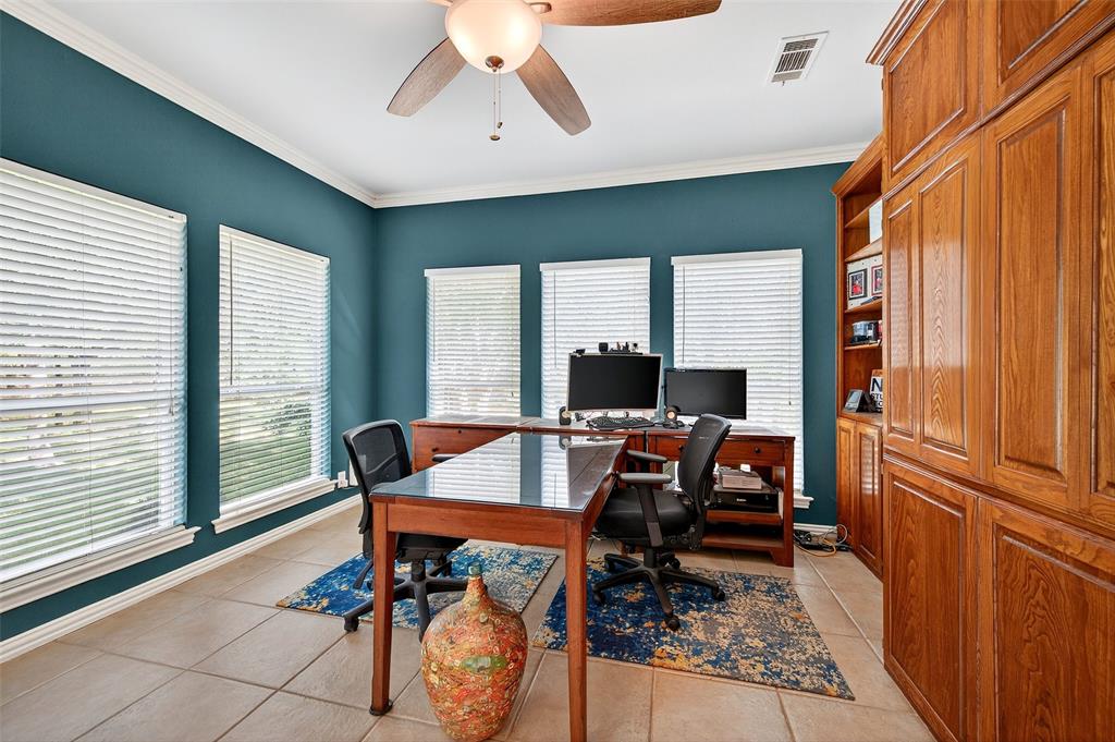 10312 Arvin Hill Road Aubrey, TX 76227 - Photo 18 of 40 a view of a workspace with furniture and a window