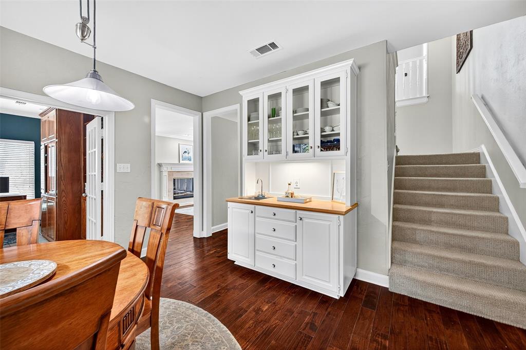 10312 Arvin Hill Road Aubrey, TX 76227 - Photo 20 of 40 a dining room with wooden floor and furniture
