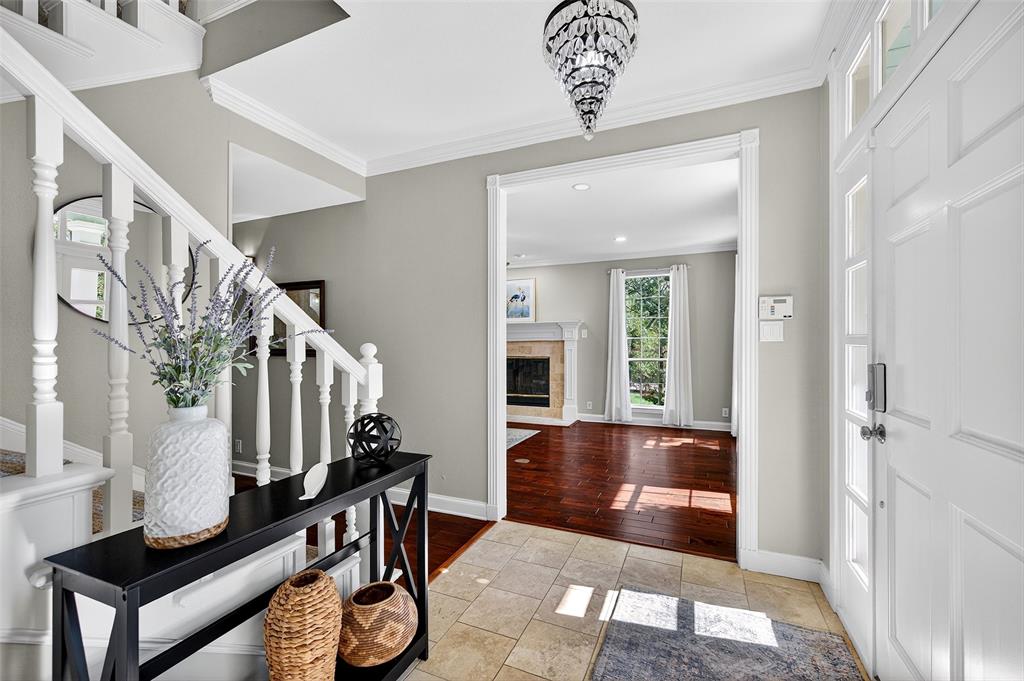 10312 Arvin Hill Road Aubrey, TX 76227 - Photo 23 of 40 a view of an entryway with a chandelier