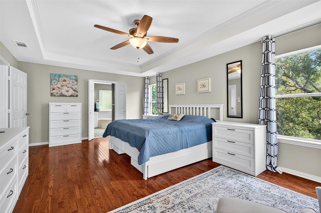 10312 Arvin Hill Road Aubrey, TX 76227 - Photo 26 of 40 a spacious bedroom with a bed and a dresser