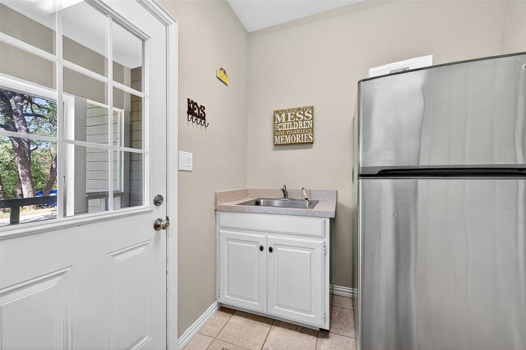 10312 Arvin Hill Road Aubrey, TX 76227 - Photo 37 of 40 a view of a bathroom with a sink and a mirror