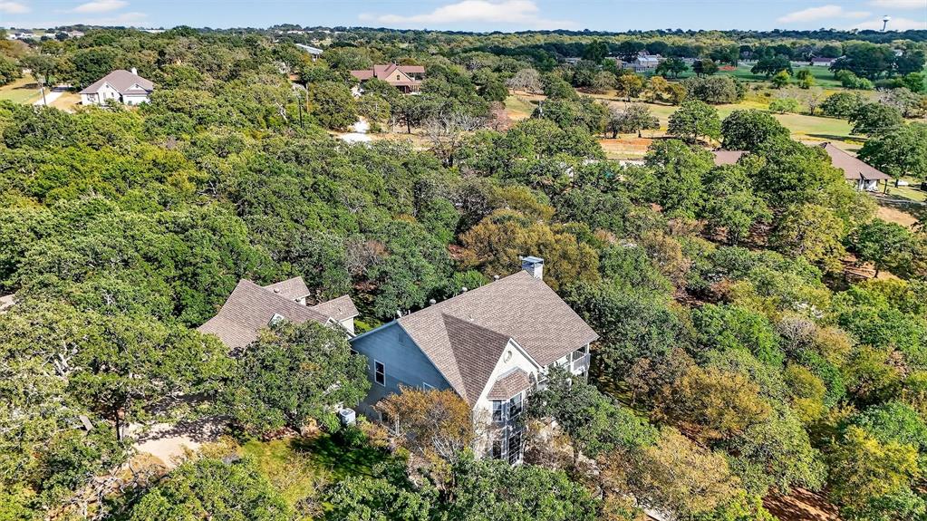 10312 Arvin Hill Road Aubrey, TX 76227 - Photo 39 of 40 an aerial view of a house with a yard and lake view