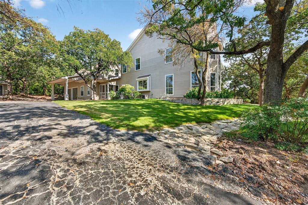 10312 Arvin Hill Road Aubrey, TX 76227 - Photo 5 of 40 a front view of a house with a yard