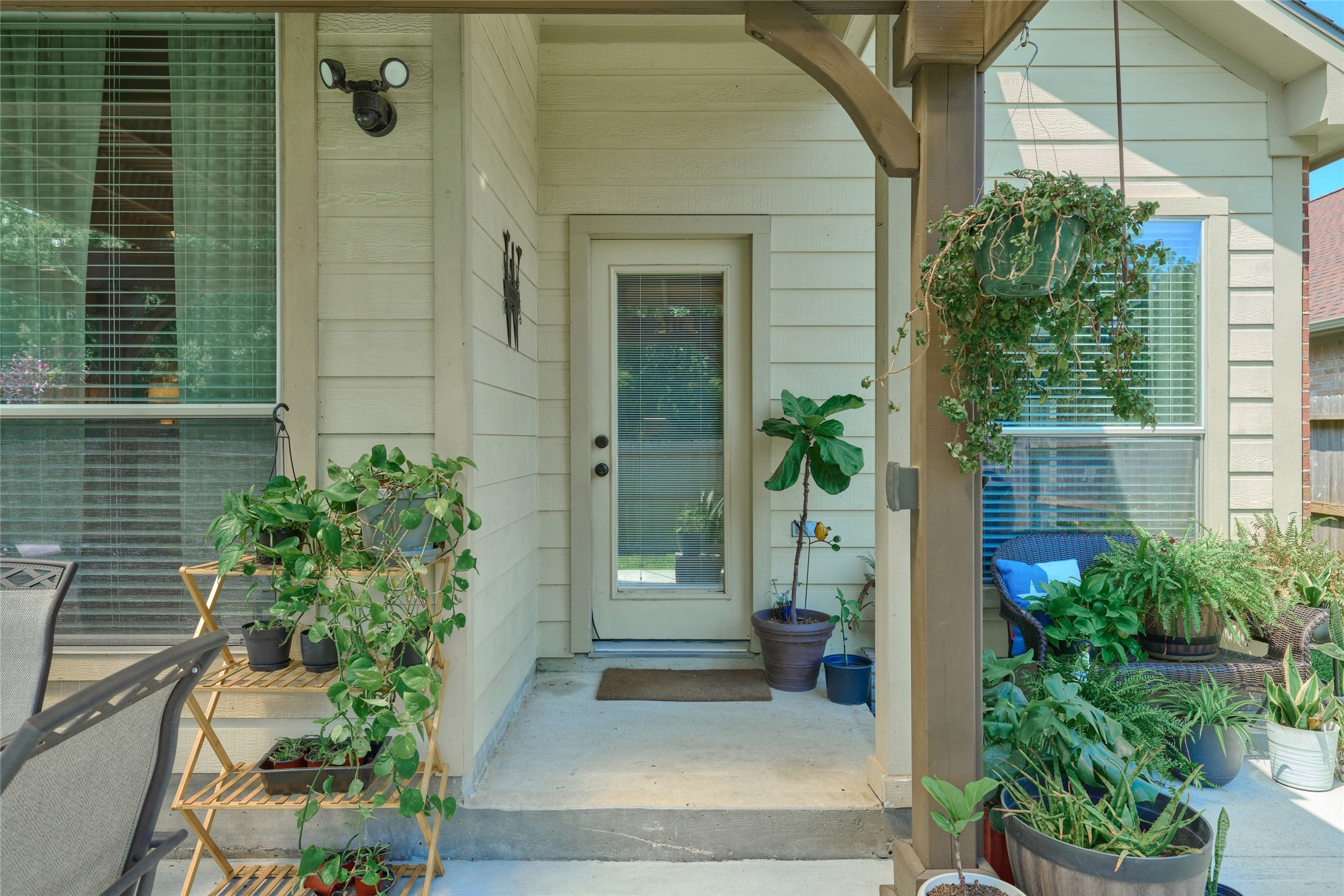 28322 Madelin Manor Lane Spring, TX 77386 - Photo 40 of 46 a potted plant sitting in front of a house