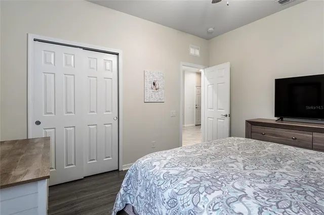 a bedroom with a bed and a couch