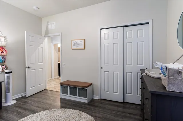 a kitchen with a refrigerator and a dining table