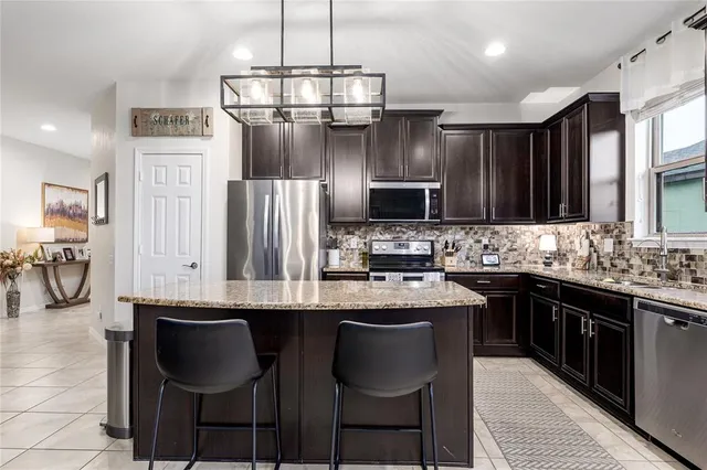 a view of a livingroom with furniture and a table chair