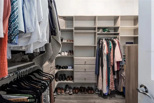 a bathroom with a double vanity sink toilet and shower