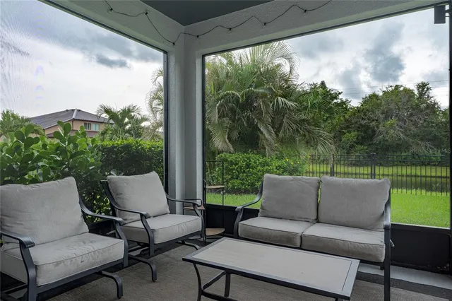 an aerial view of multiple houses with a yard