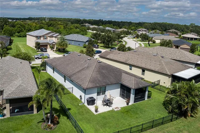 a view of a house with porch and garden