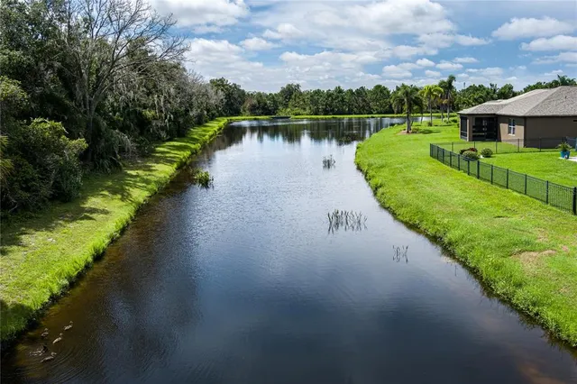 an aerial view of a house with a yard table and chairs