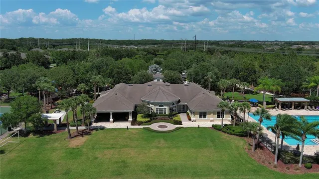 an aerial view of a house with garden space and street view