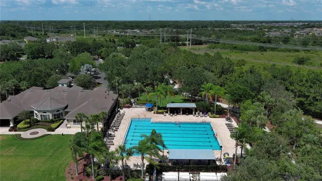 a view of a golf course with chairs and an outdoor space