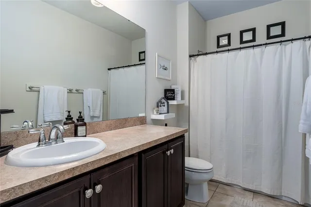 a bedroom with a bed and a view of bedroom