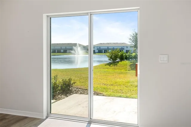 an aerial view of a house with a swimming pool