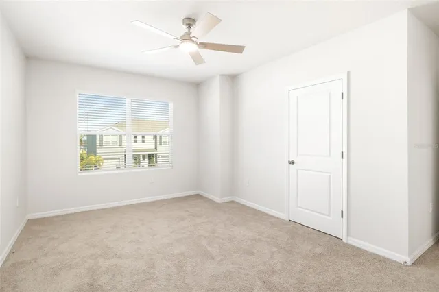 a view of a swimming pool with a patio and a yard