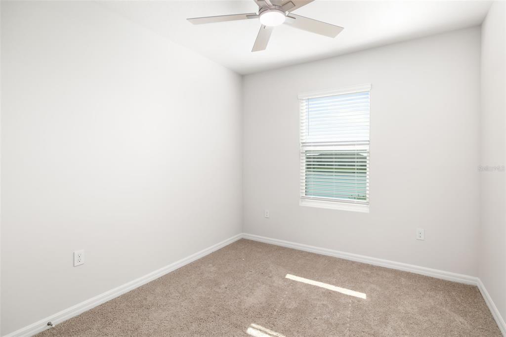 17436 Haysack Terrace Bradenton, FL 34211 - Photo 20 of 53 an empty room with a window and a fan