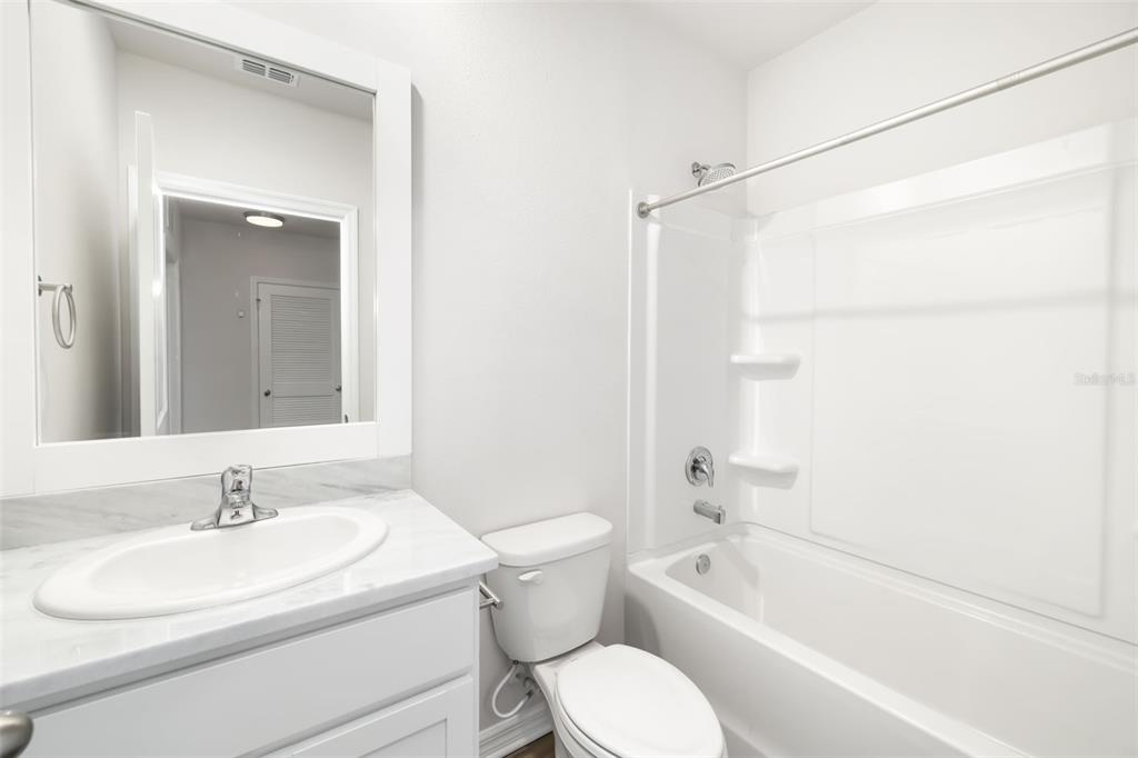 17436 Haysack Terrace Bradenton, FL 34211 - Photo 21 of 53 a bathroom with a sink toilet and shower