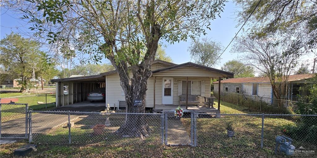 304 4th Street Santa Rosa, TX 78593 - Photo 1 of 1 Bungalow-style house featuring a carport