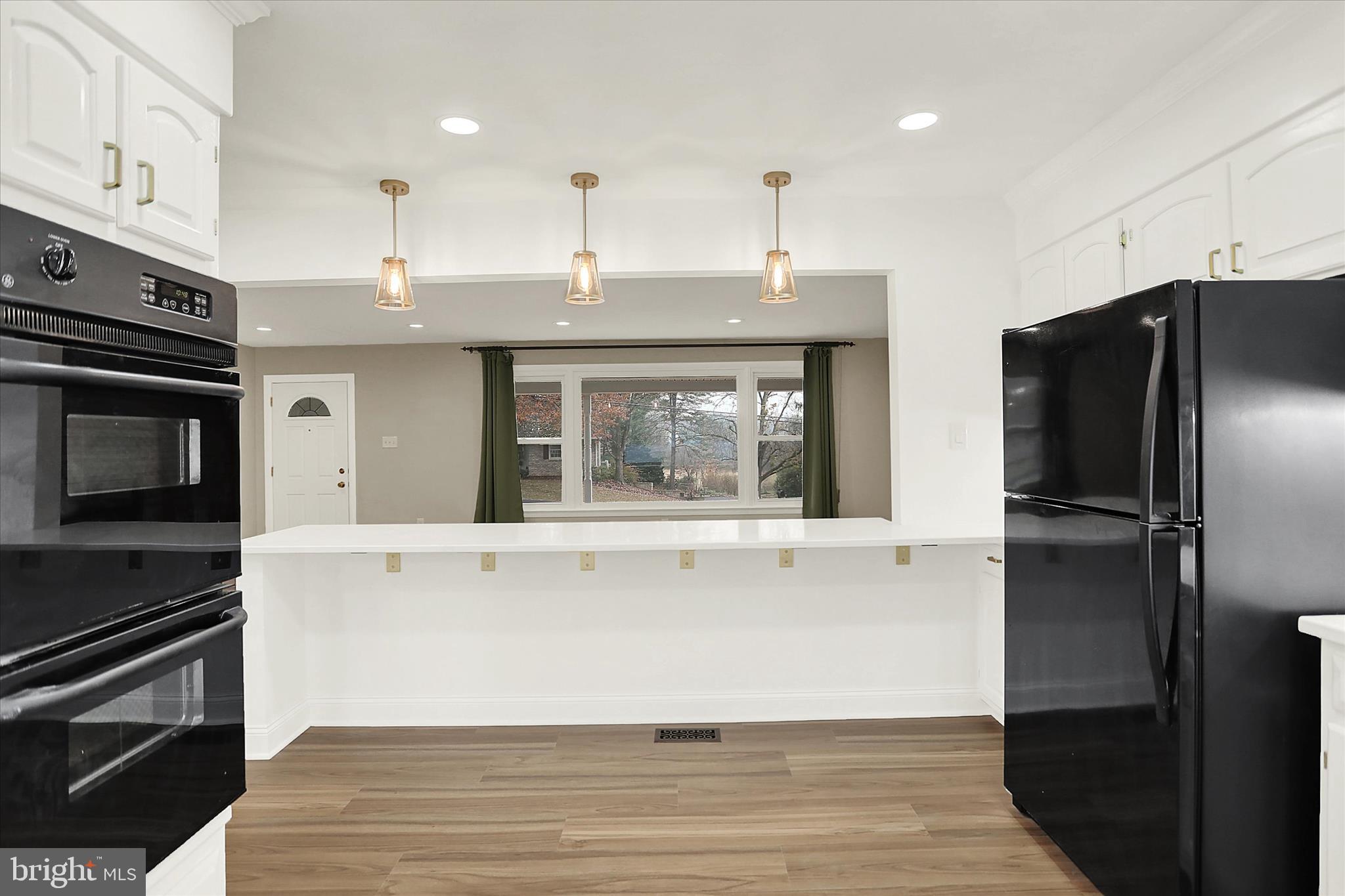 1612 Elbridge Road Harrisburg, PA 17112 - Photo 12 of 39 a view of a kitchen with a sink stove and refrigerator