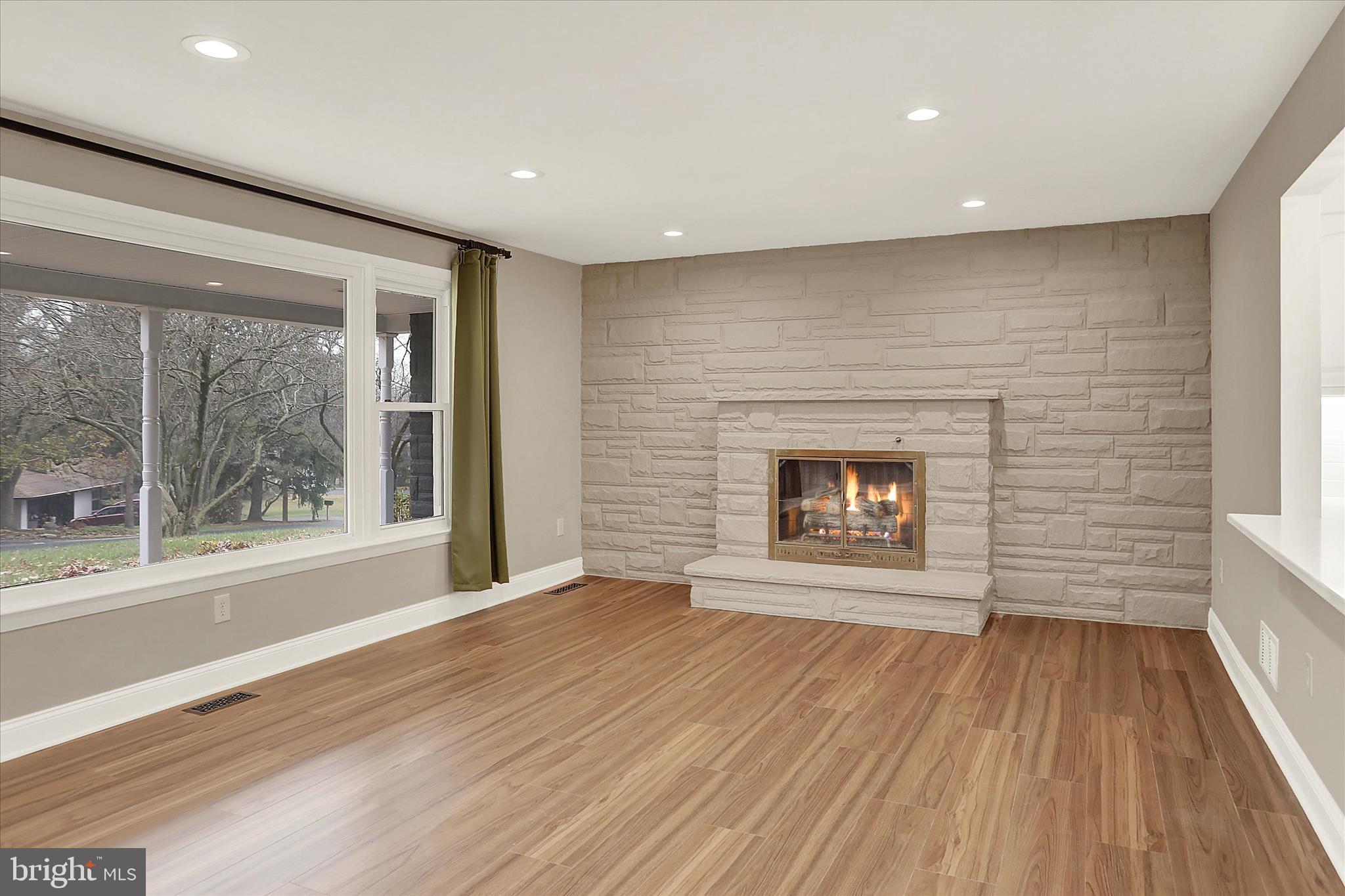 1612 Elbridge Road Harrisburg, PA 17112 - Photo 14 of 39 a view of an empty room with a window and wooden floor