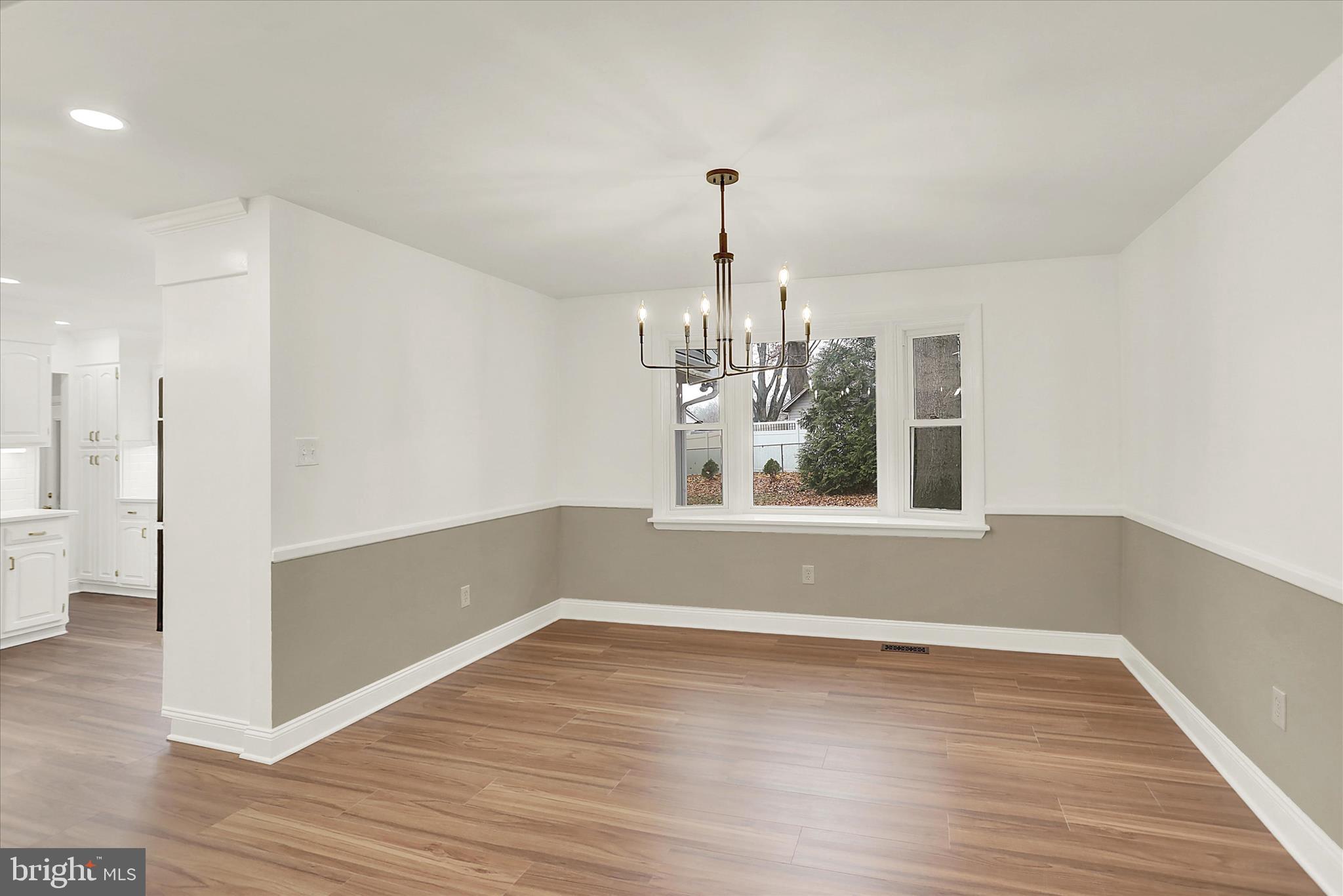 1612 Elbridge Road Harrisburg, PA 17112 - Photo 17 of 39 a view of a room with wooden floor chandelier and entryway