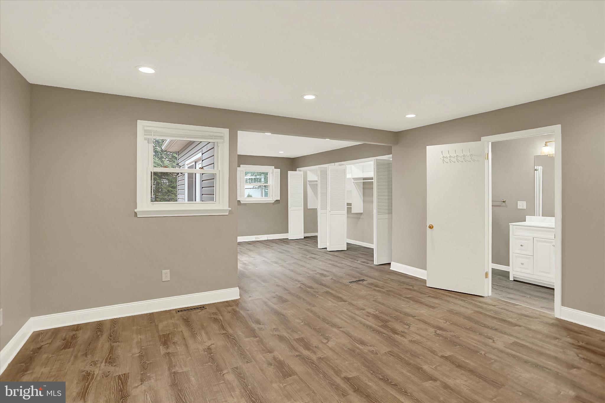 1612 Elbridge Road Harrisburg, PA 17112 - Photo 22 of 39 a view of an empty room with wooden floor and a window