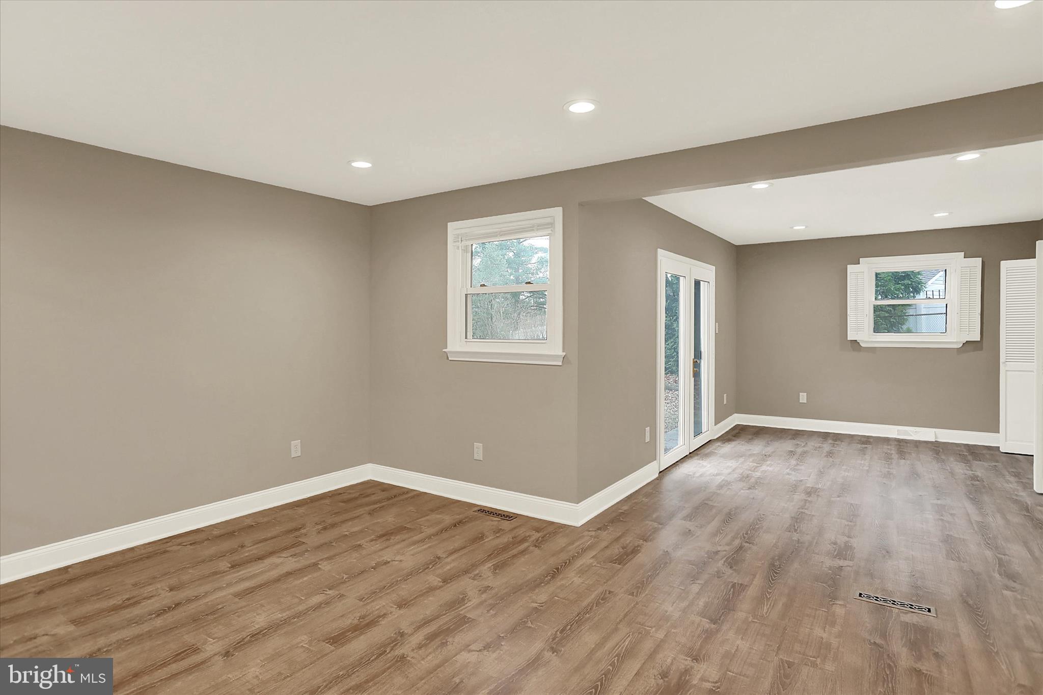 1612 Elbridge Road Harrisburg, PA 17112 - Photo 24 of 39 a view of an empty room with wooden floor and a window