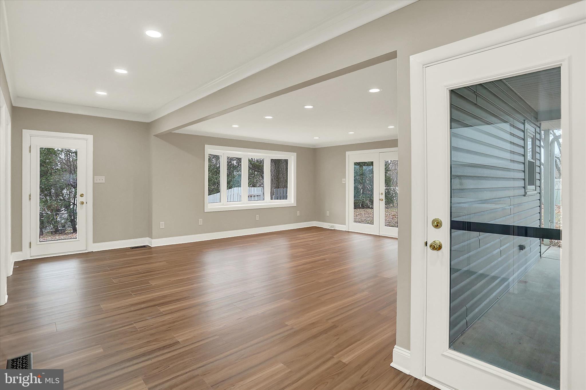 1612 Elbridge Road Harrisburg, PA 17112 - Photo 7 of 39 a view of a big room with wooden floor and windows