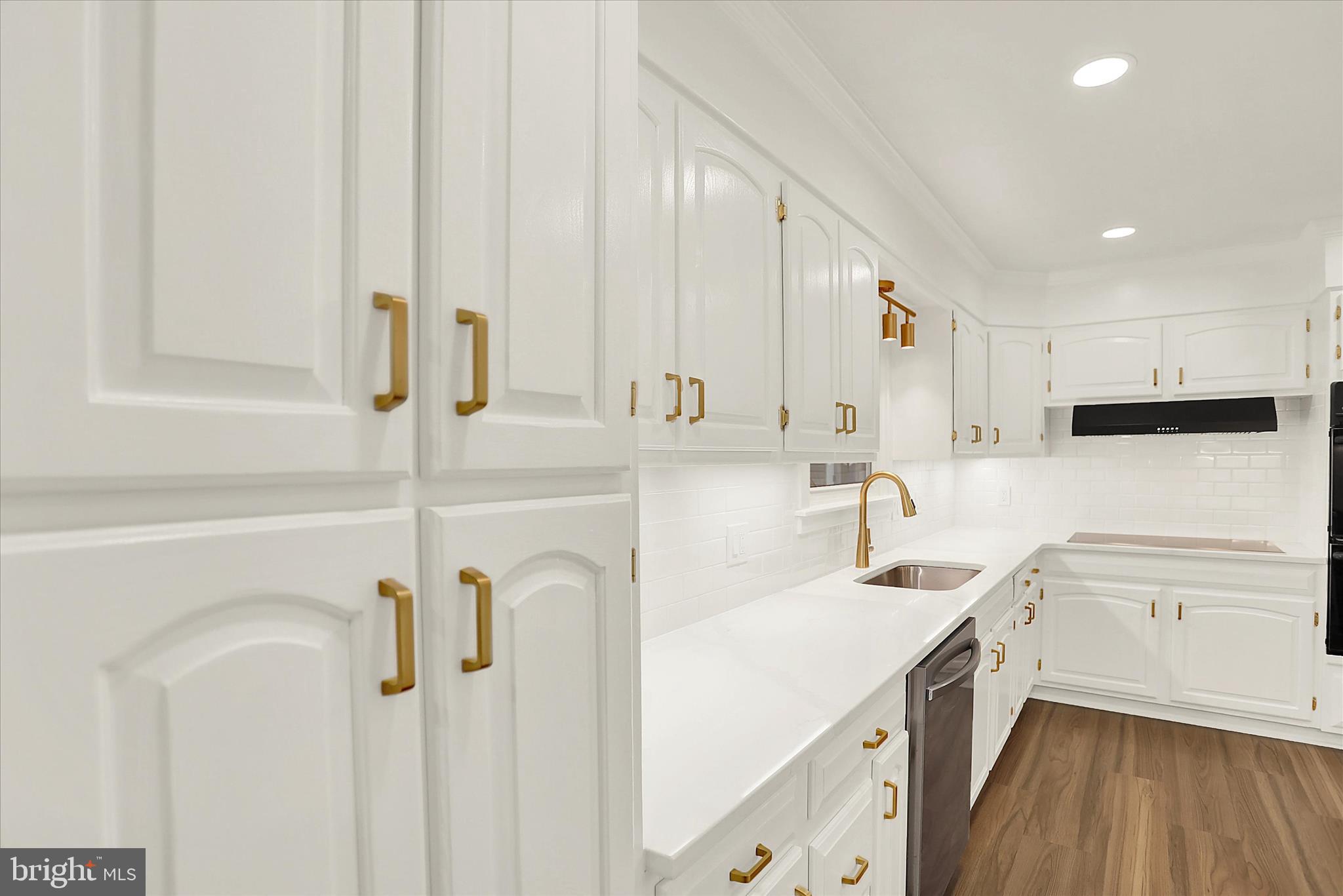 1612 Elbridge Road Harrisburg, PA 17112 - Photo 8 of 39 a kitchen with a refrigerator a sink and cabinets