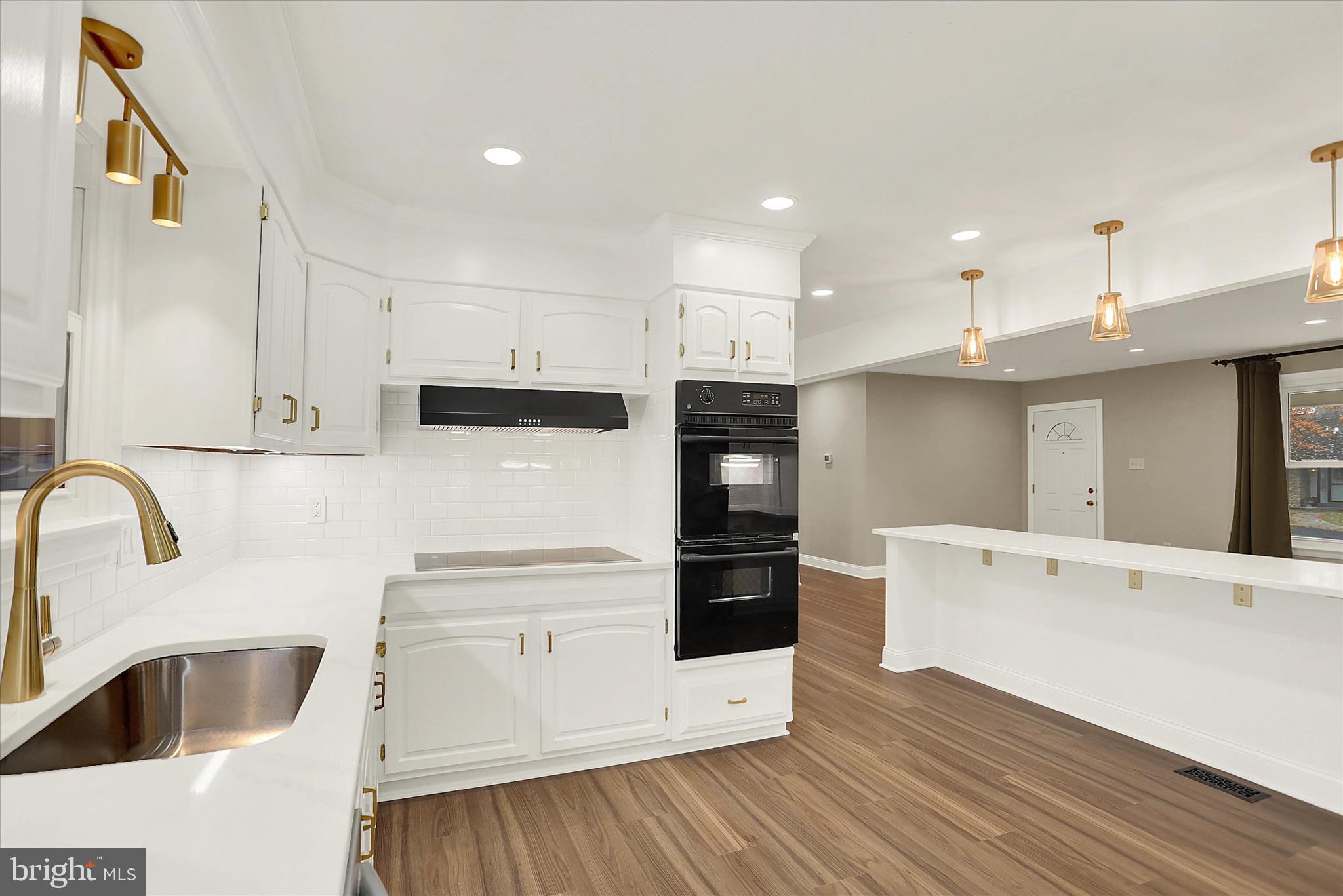 1612 Elbridge Road Harrisburg, PA 17112 - Photo 9 of 39 a kitchen with granite countertop a refrigerator and a sink