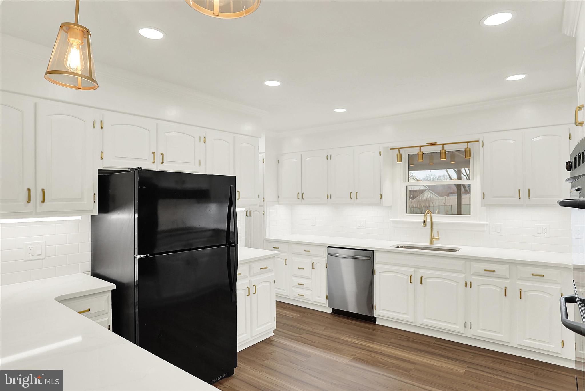 1612 Elbridge Road Harrisburg, PA 17112 - Photo 10 of 39 a kitchen with a refrigerator and a sink