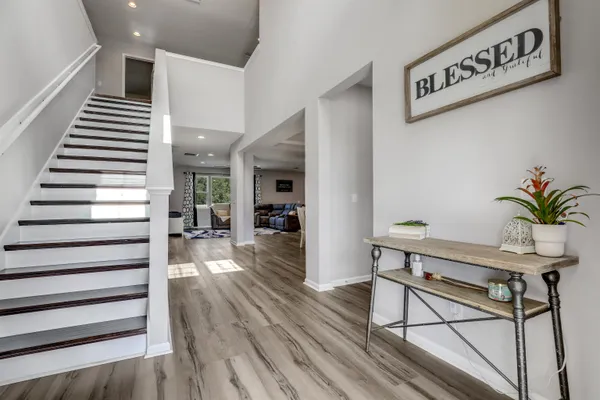 a view of a dining room with furniture window and wooden floor