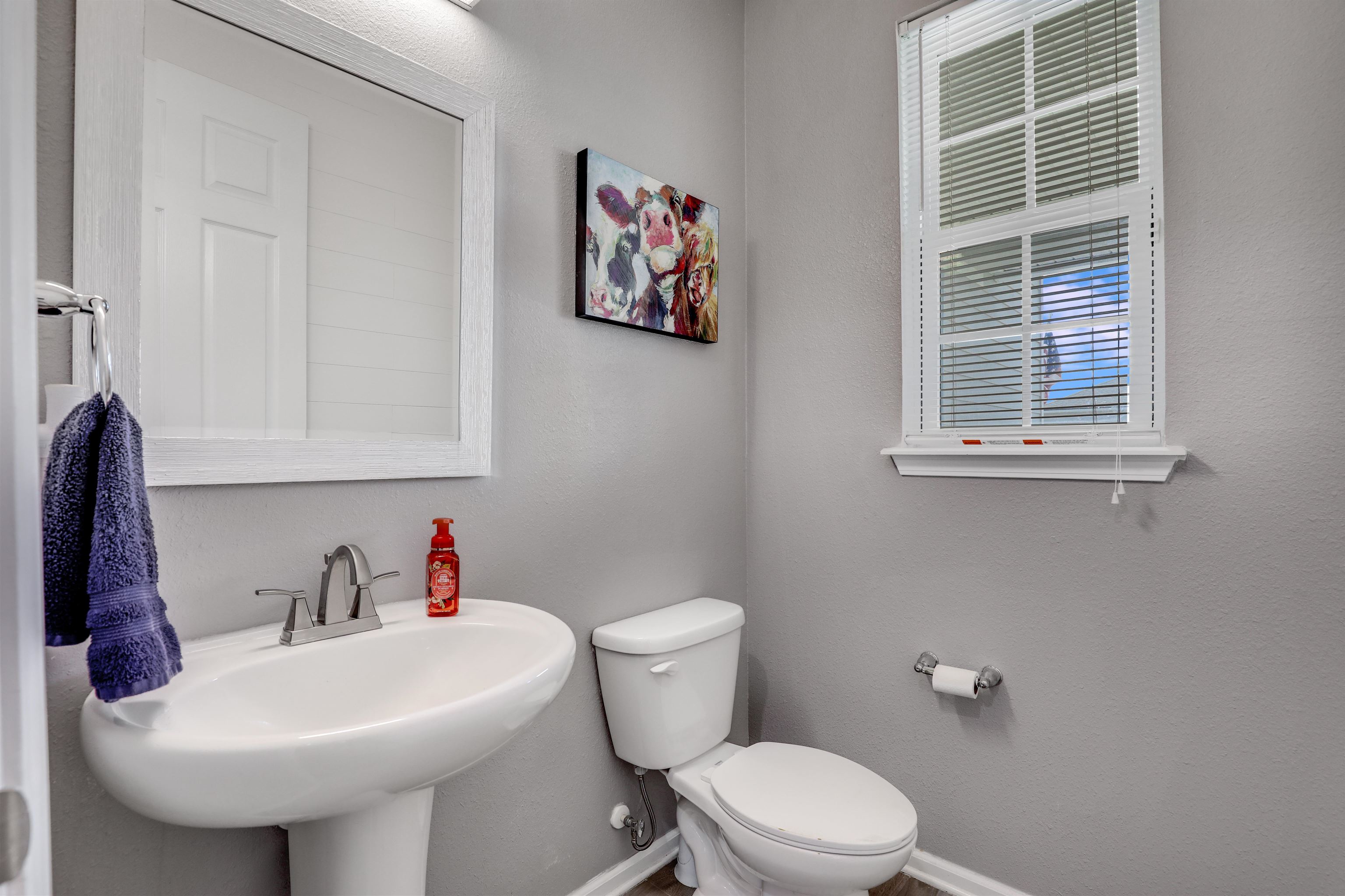 93 Firefly Trace St. Augustine, FL 32092 - Photo 16 of 76 a bathroom with a sink a toilet and a mirror