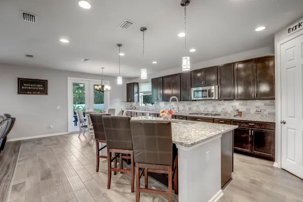 a bathroom with double sink and mirror