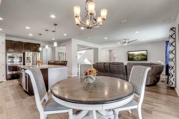 a white toilet sitting next to a bath tub