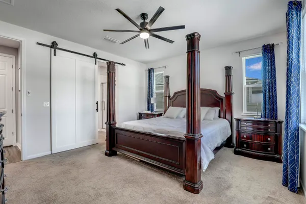 a view of a house with swimming pool and sitting area