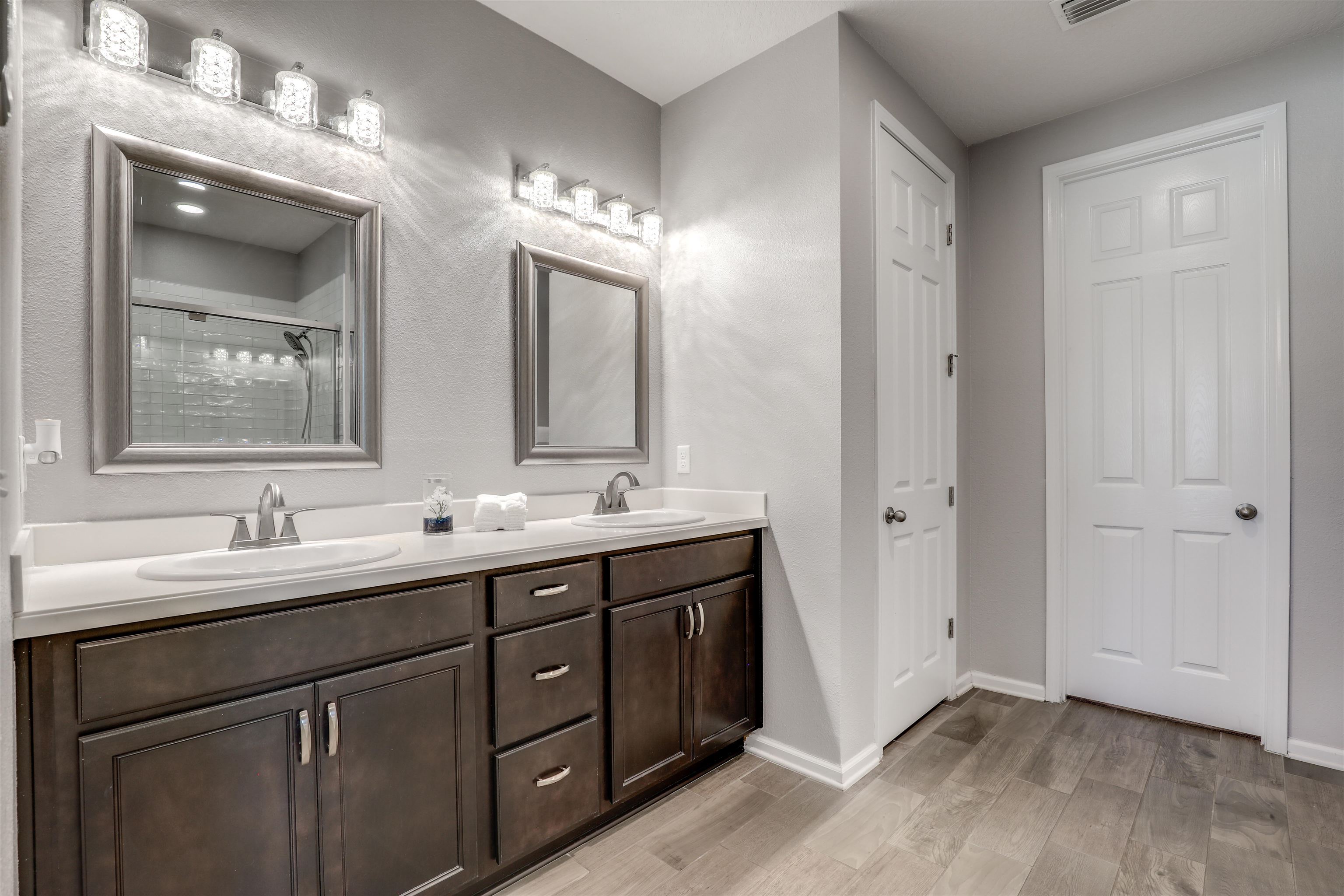 93 Firefly Trace St. Augustine, FL 32092 - Photo 34 of 76 a bathroom with double sink and mirror