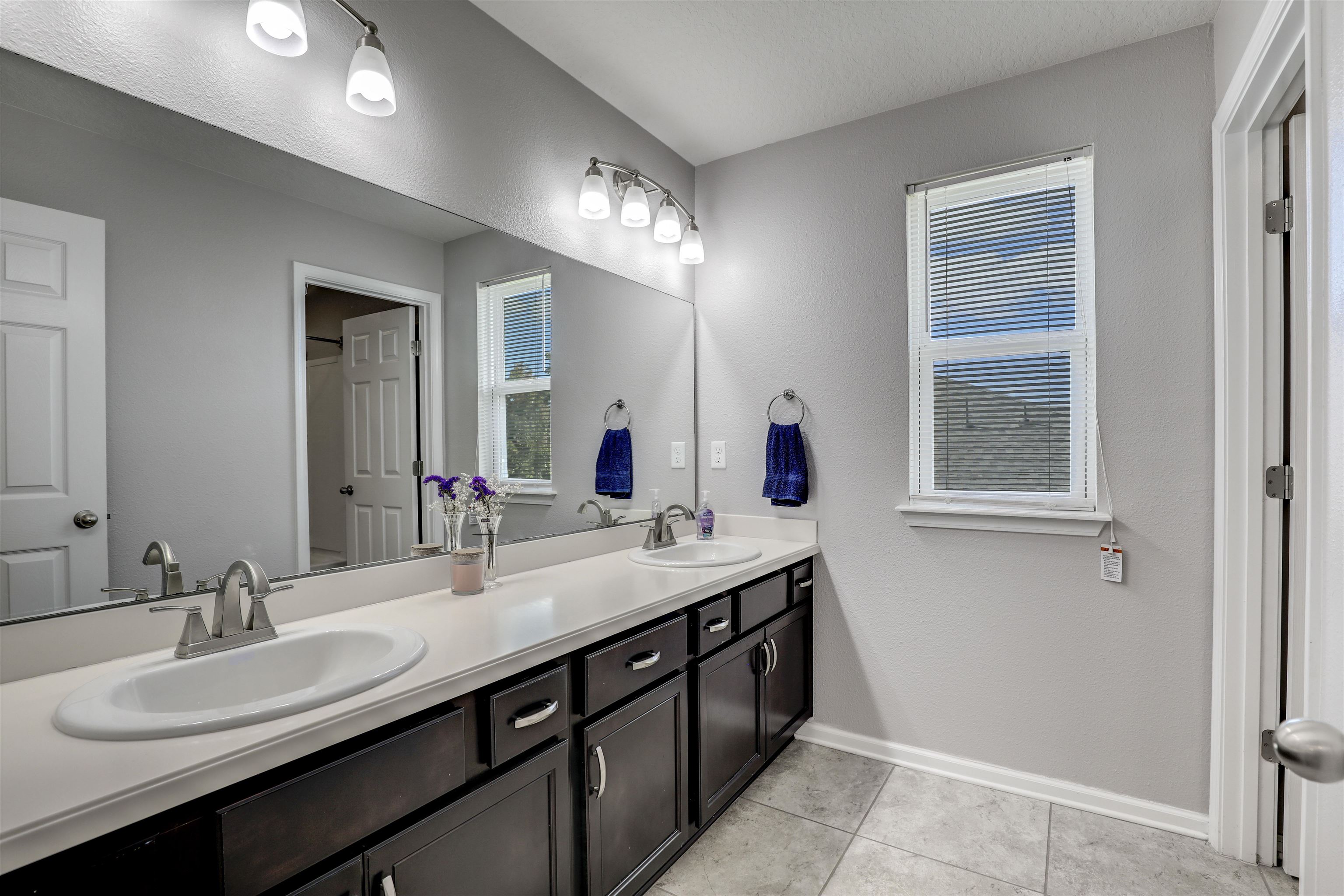93 Firefly Trace St. Augustine, FL 32092 - Photo 40 of 76 a bathroom with a double vanity sink and a mirror