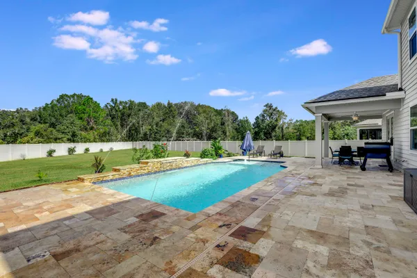 a front view of building with cars parked