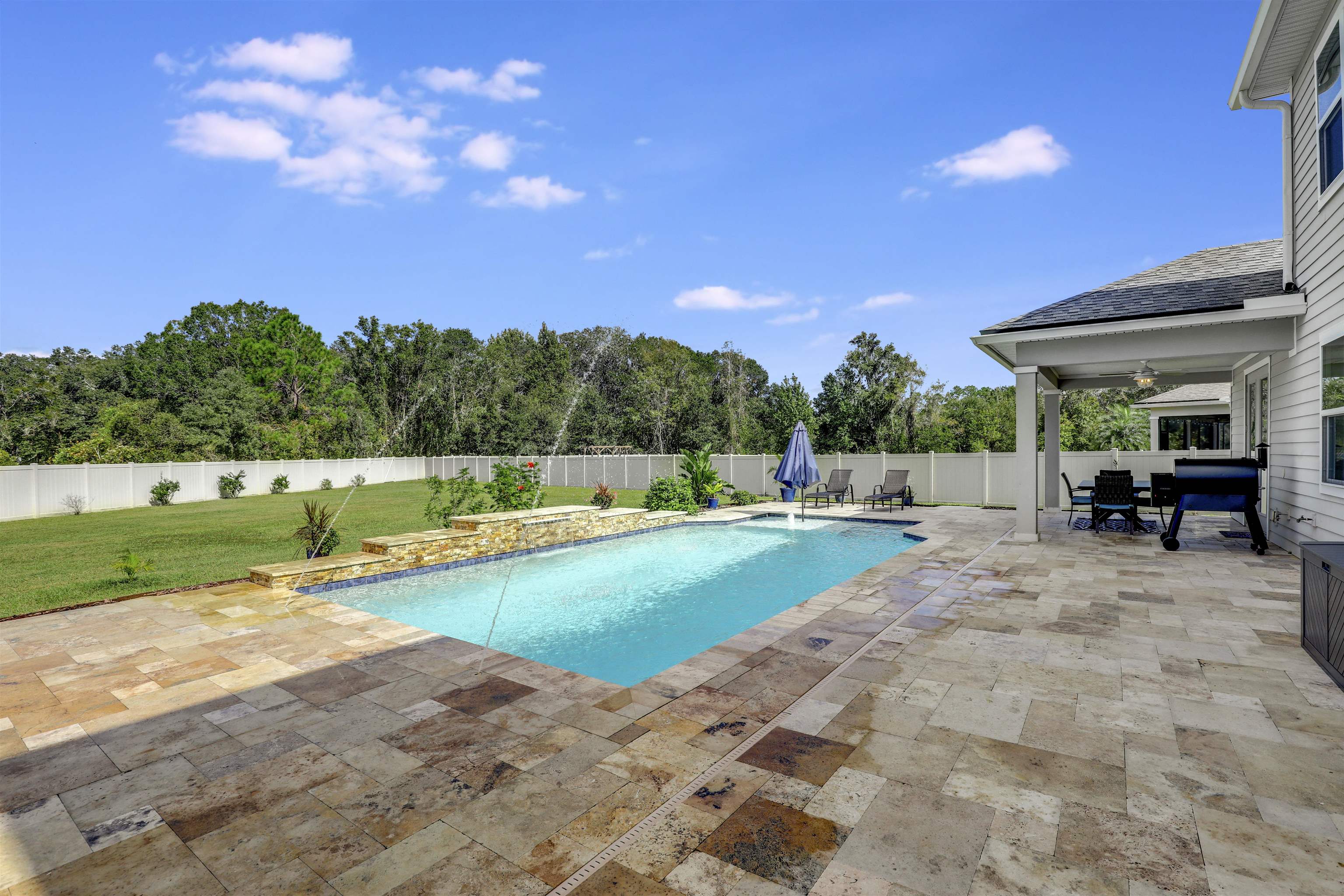 93 Firefly Trace St. Augustine, FL 32092 - Photo 48 of 76 a view of a swimming pool with a patio