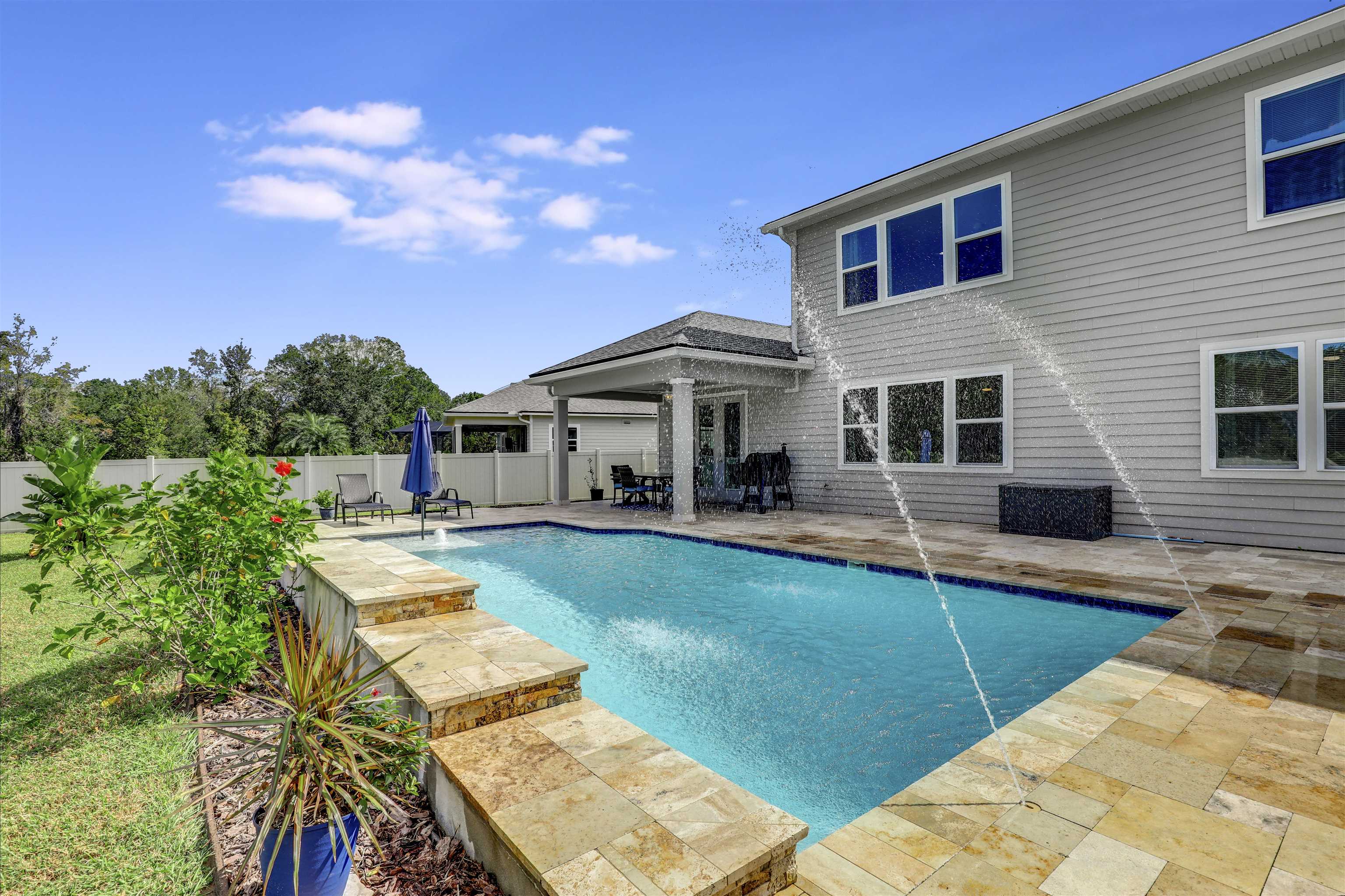 93 Firefly Trace St. Augustine, FL 32092 - Photo 49 of 76 a view of a house with swimming pool and sitting area