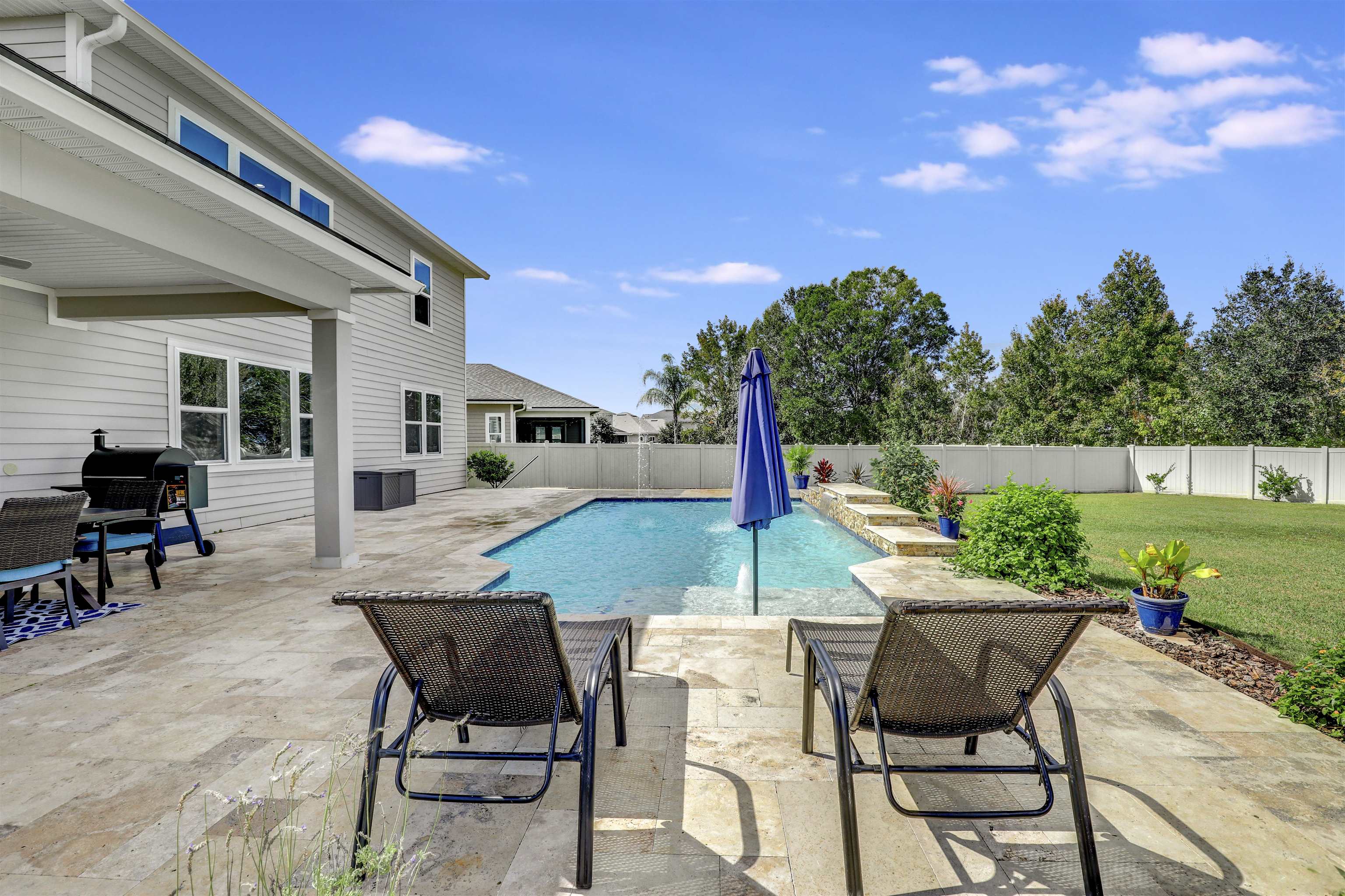93 Firefly Trace St. Augustine, FL 32092 - Photo 50 of 76 a patio with glass top table and chairs