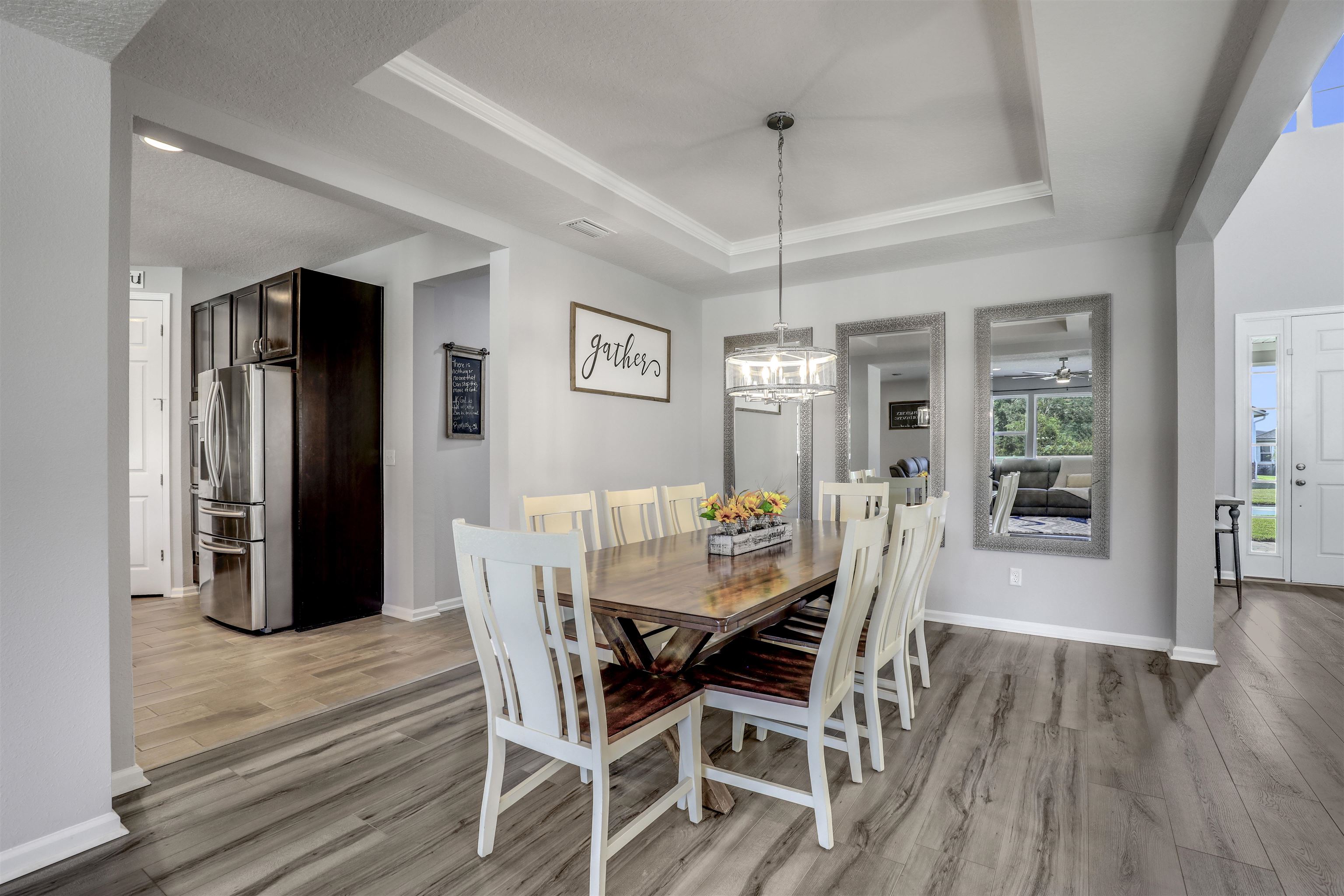 93 Firefly Trace St. Augustine, FL 32092 - Photo 5 of 76 a view of a dining room with furniture window and wooden floor